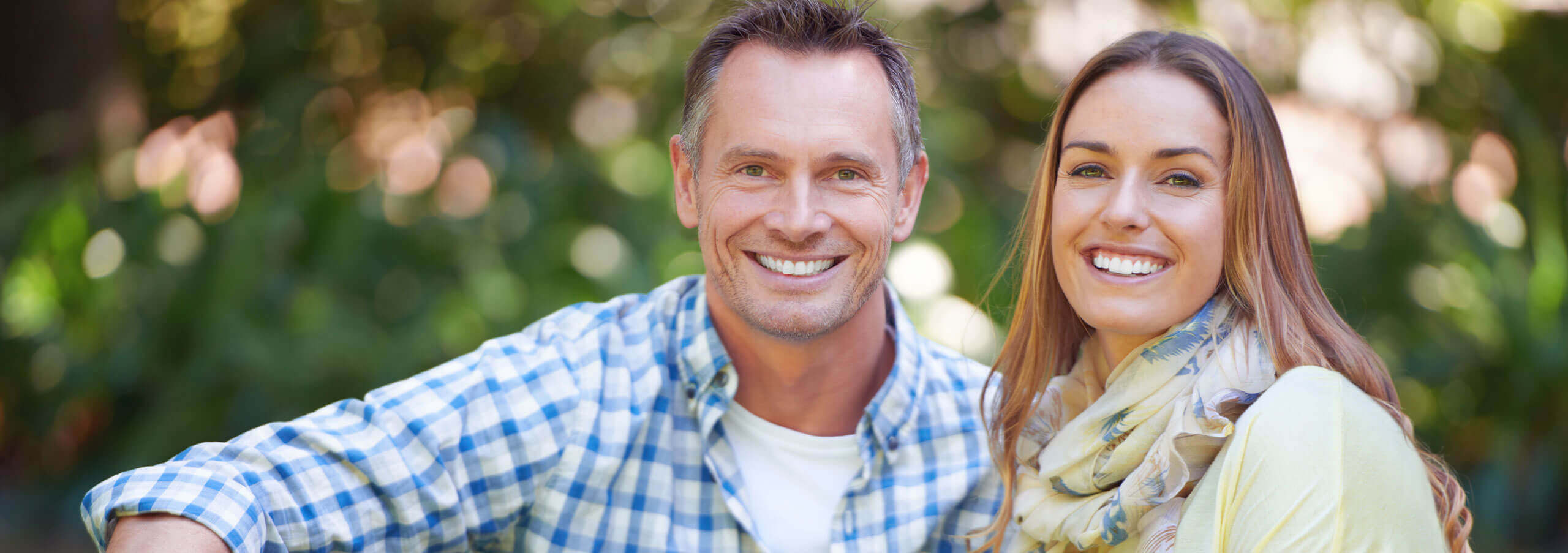 couple sitting outside smiling