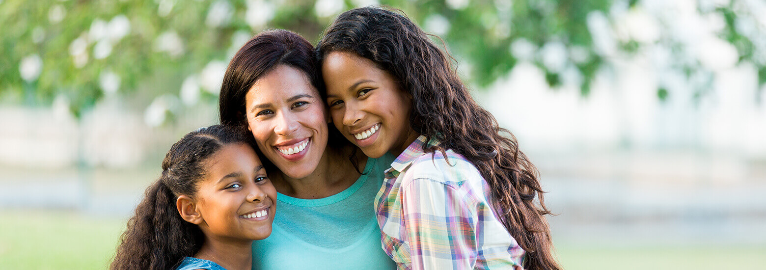 happy mother and her two daughters