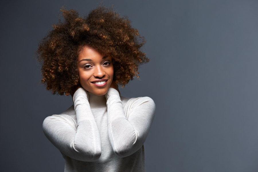 Pretty black lady with beautiful teeth.