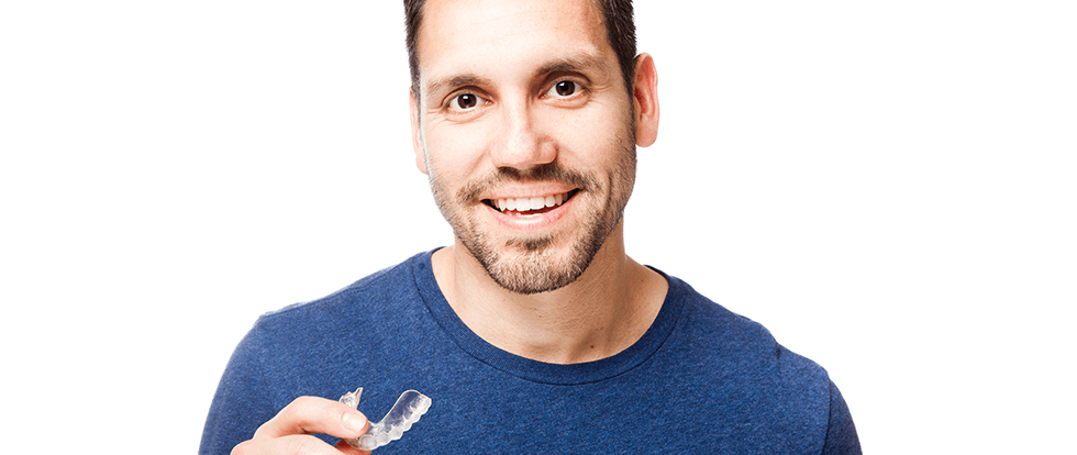 man with clear aligners