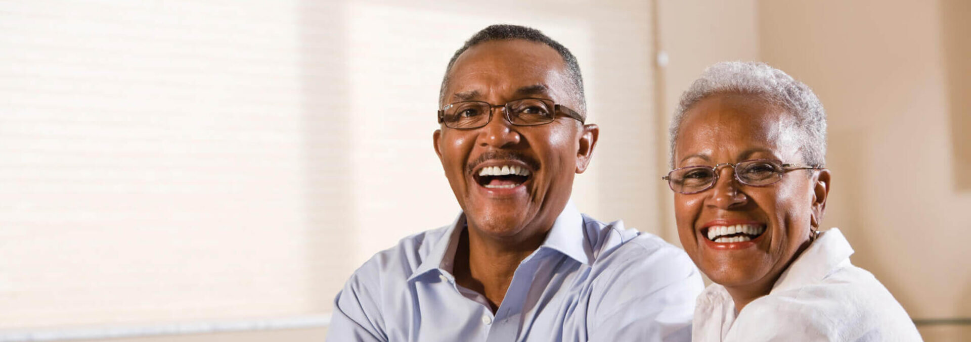 older couple smiling with dentures