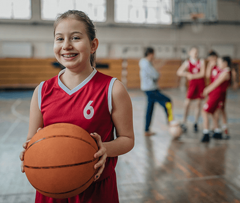 girl playing basketball