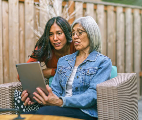 two women looking at a computer